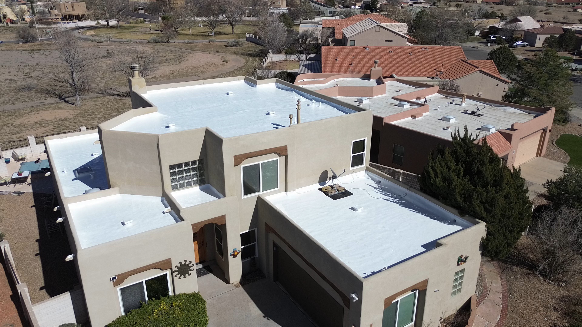 Modified bitumen flat roof with spray foam and silicone in Rio Rancho, New Mexico